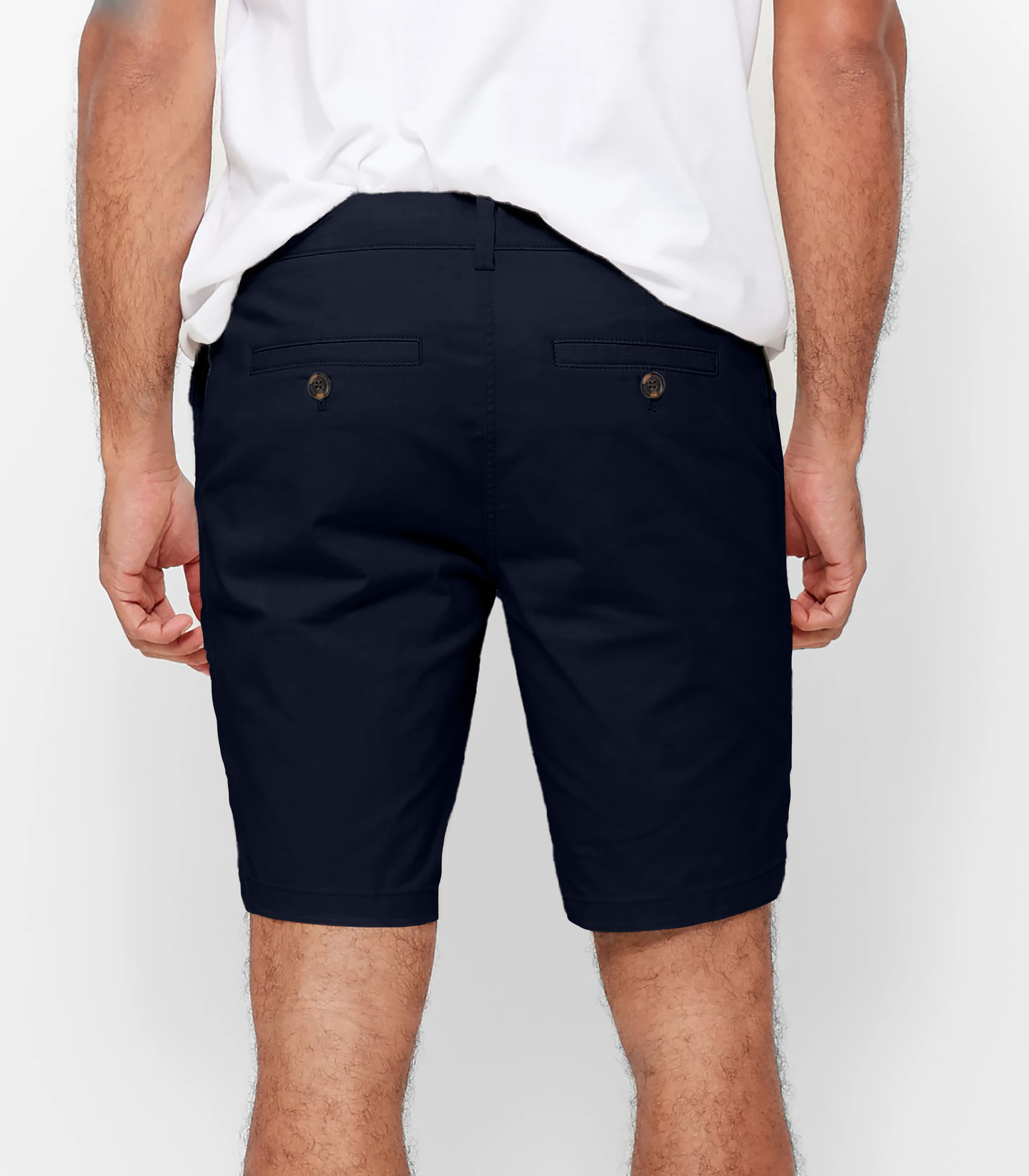 Mens Navy chinos shorts with front slanted pockets, jetted back pockets. zip fly fastening and brown horne buttons on the waistband and back pockets, the fit is a slim fit, this is worn with a white tee and white t-shirt
