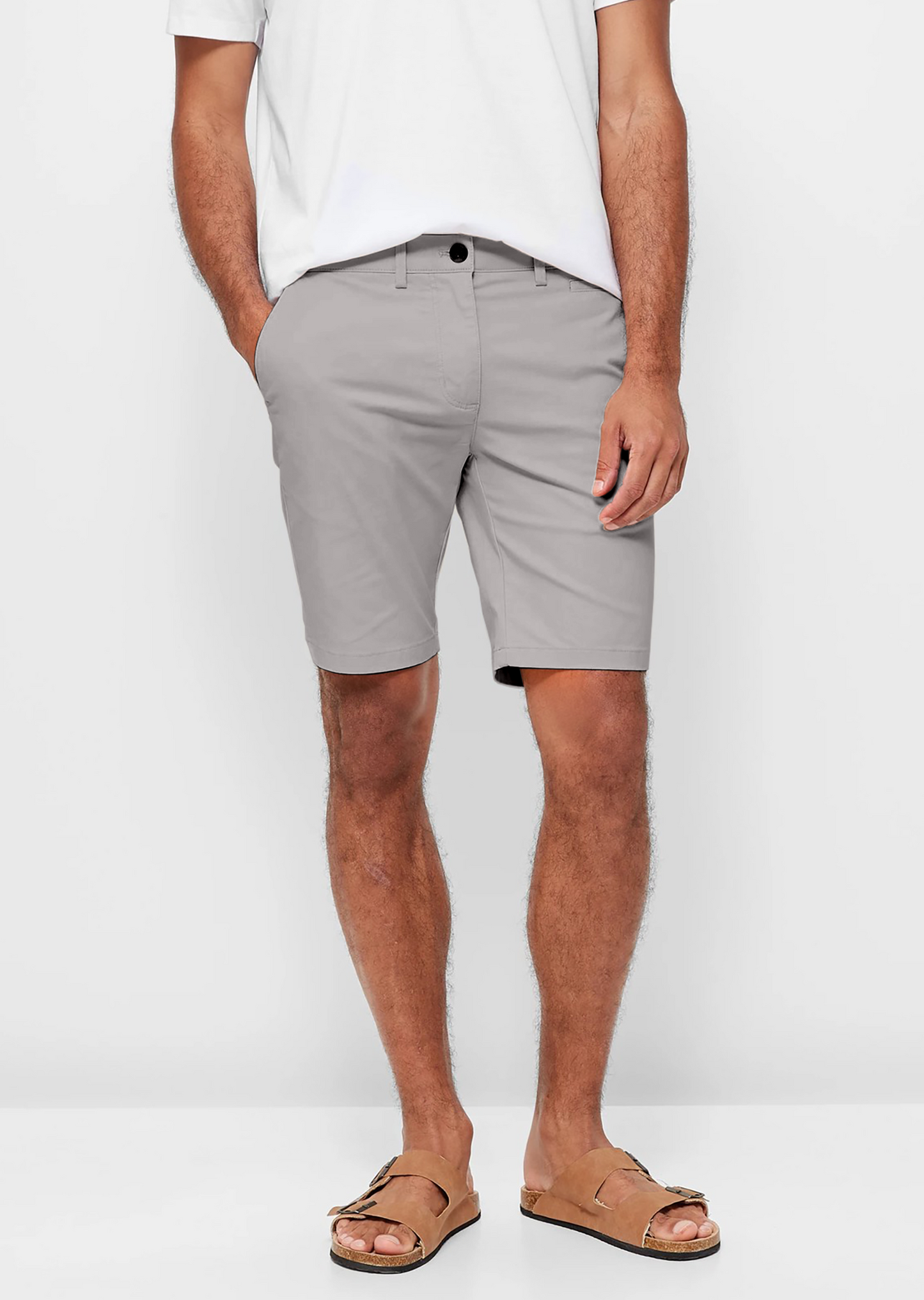 Mens Silver Grey chinos shorts with front slanted pockets, jetted back pockets. zip fly fastening and brown horne buttons on the waistband and back pockets, the fit is a slim fit, this is worn with a white tee and white t-shirt