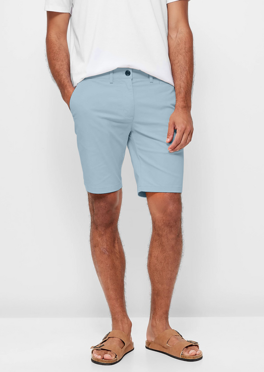 Mens Sky Blue chinos shorts with front slanted pockets, jetted back pockets. zip fly fastening and brown horne buttons on the waistband and back pockets, the fit is a slim fit, this is worn with a white tee and white t-shirt