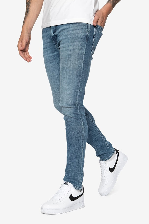 Striker Skinny Flxtreme Jeans In Mid Wash - DML Jeans 